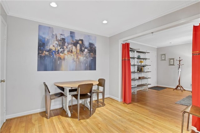 dining area with ornamental molding, baseboards, recessed lighting, and wood finished floors