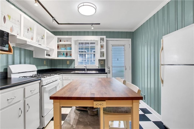 kitchen with open shelves, a sink, wooden counters, white appliances, and light floors