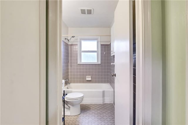 full bathroom with visible vents, toilet, and bathtub / shower combination