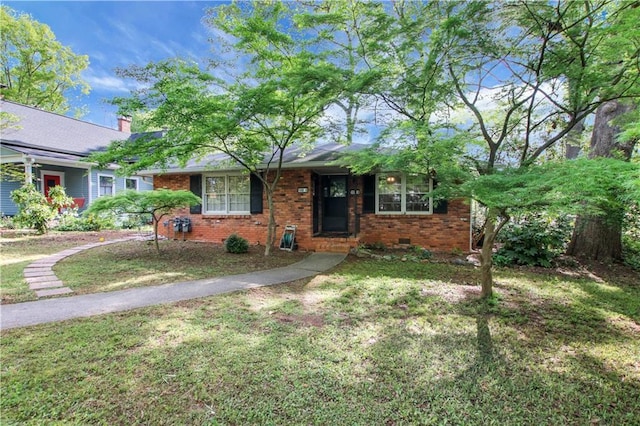 ranch-style house with brick siding, crawl space, and a front lawn