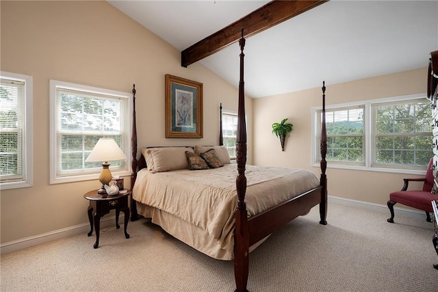 bedroom with vaulted ceiling with beams, light colored carpet, and multiple windows