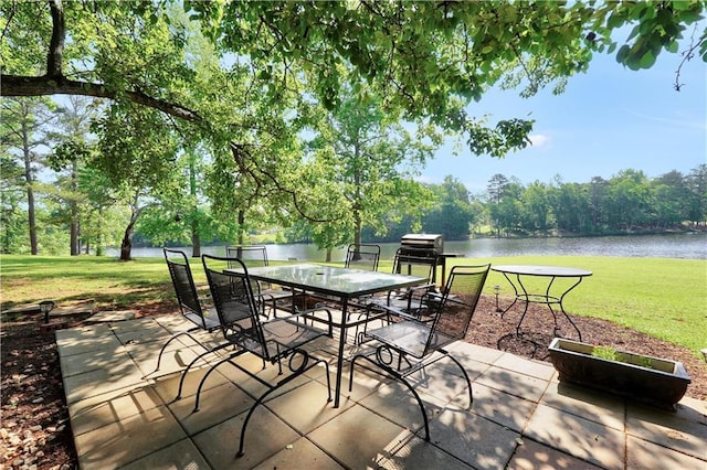 70 Lake Charles Xing, Covington, GA 30016 - view of patio / terrace featuring a water view and outdoor dining area