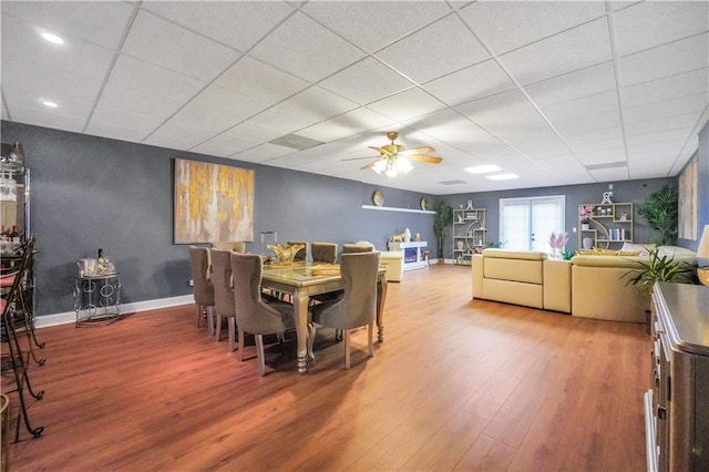 70 Lake Charles Xing, Covington, GA 30016 - dining space featuring wood finished floors, a drop ceiling, baseboards, ceiling fan, and recessed lighting