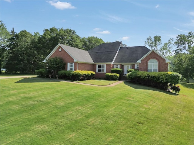 70 Lake Charles Xing, Covington, GA 30016 - view of front of home with brick siding and a front yard