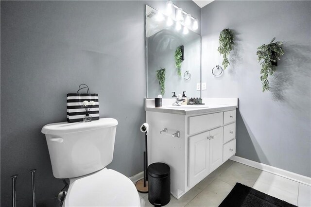 70 Lake Charles Xing, Covington, GA 30016 - half bathroom with toilet, tile patterned flooring, vanity, and baseboards