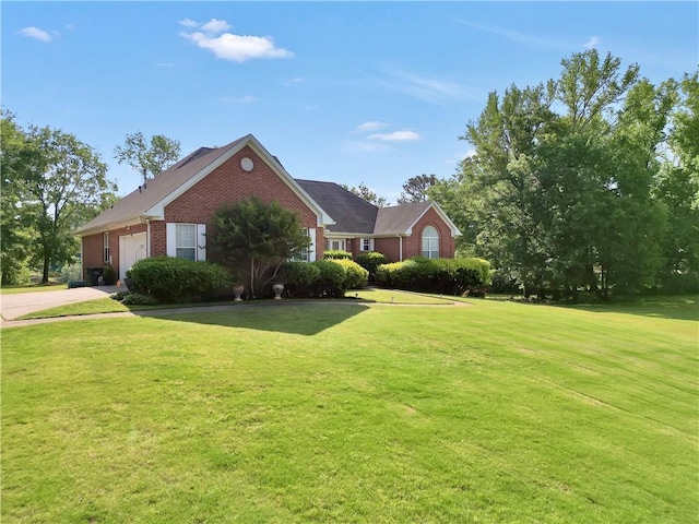 70 Lake Charles Xing, Covington, GA 30016 - view of side of property with brick siding, concrete driveway, a yard, and an attached garage