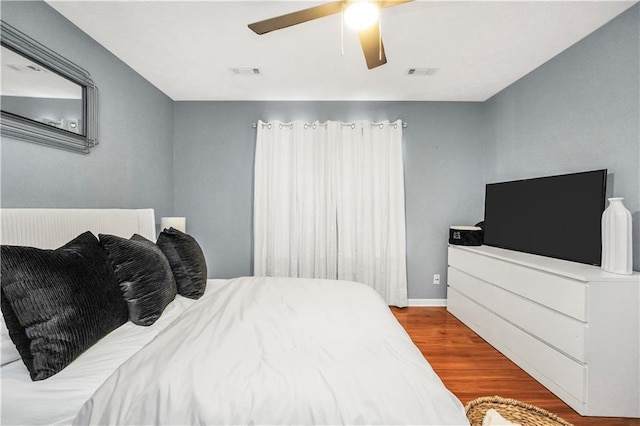70 Lake Charles Xing, Covington, GA 30016 - bedroom with wood finished floors, ceiling fan, and baseboards