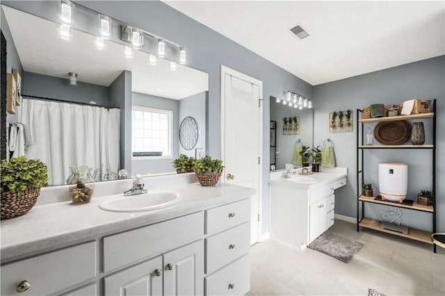 70 Lake Charles Xing, Covington, GA 30016 - bathroom featuring two vanities, baseboards, and a shower with curtain