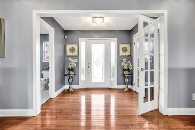 70 Lake Charles Xing, Covington, GA 30016 - foyer with hardwood / wood-style floors and baseboards