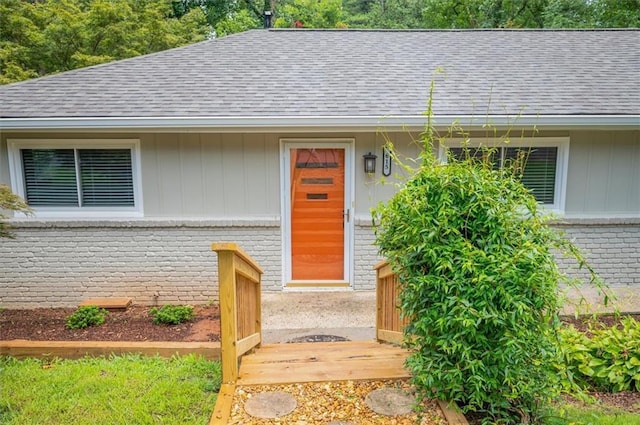 doorway to property with a wooden deck