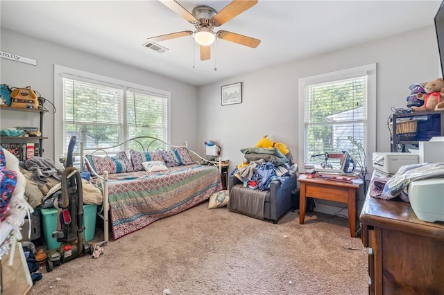 312 Glen Iris Dr, Monroe, GA 30655 - bedroom featuring carpet, multiple windows, and a ceiling fan