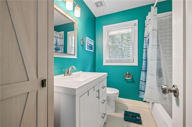 312 Glen Iris Dr, Monroe, GA 30655 - full bath featuring vanity, tile patterned flooring, and shower / bath combo with shower curtain