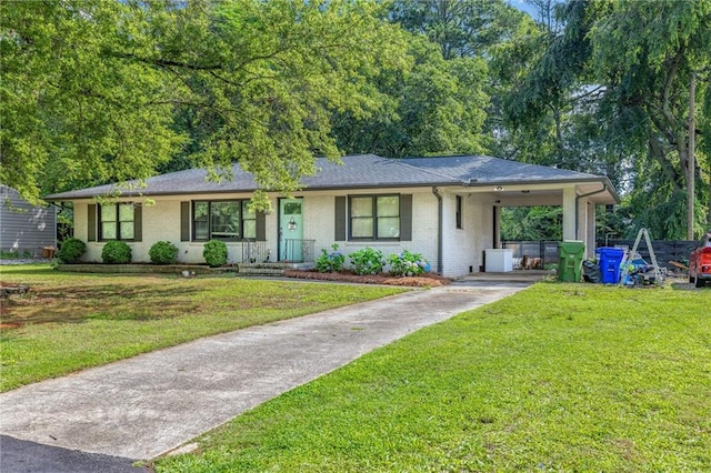 312 Glen Iris Dr, Monroe, GA 30655 - ranch-style home featuring concrete driveway, brick siding, a front lawn, and an attached carport
