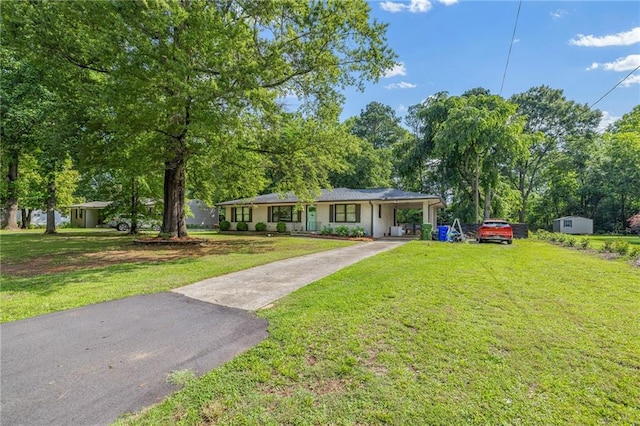 312 Glen Iris Dr, Monroe, GA 30655 - single story home with driveway, a front yard, and a carport