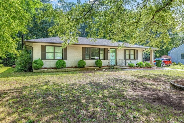 312 Glen Iris Dr, Monroe, GA 30655 - ranch-style house with brick siding and a front lawn