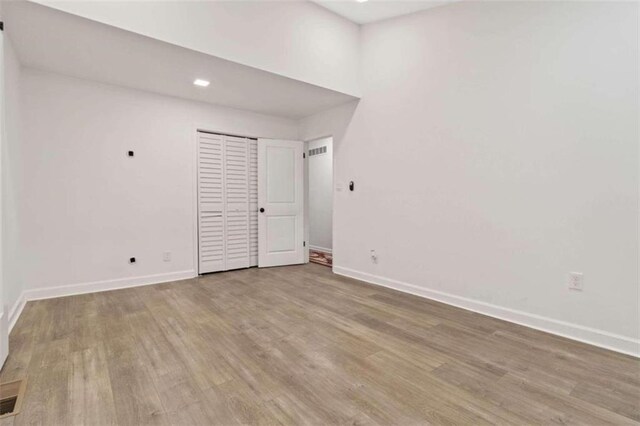 spare room featuring light hardwood / wood-style floors