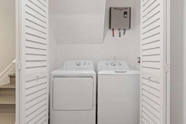 clothes washing area featuring independent washer and dryer