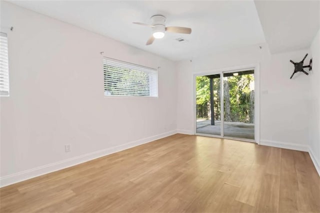 spare room featuring light wood-type flooring and ceiling fan