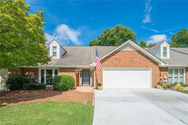 535 Brickleberry Ln, Roswell, GA 30075 - cape cod home featuring a garage, brick siding, concrete driveway, and a shingled roof