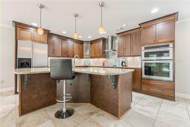 535 Brickleberry Ln, Roswell, GA 30075 - kitchen featuring stainless steel appliances, wall chimney range hood, decorative backsplash, light stone countertops, and recessed lighting