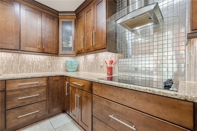 535 Brickleberry Ln, Roswell, GA 30075 - kitchen with backsplash, wall chimney range hood, black electric stovetop, light tile patterned flooring, and brown cabinets