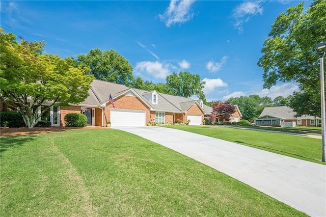 535 Brickleberry Ln, Roswell, GA 30075 - view of front of home featuring an attached garage, a front yard, brick siding, and concrete driveway