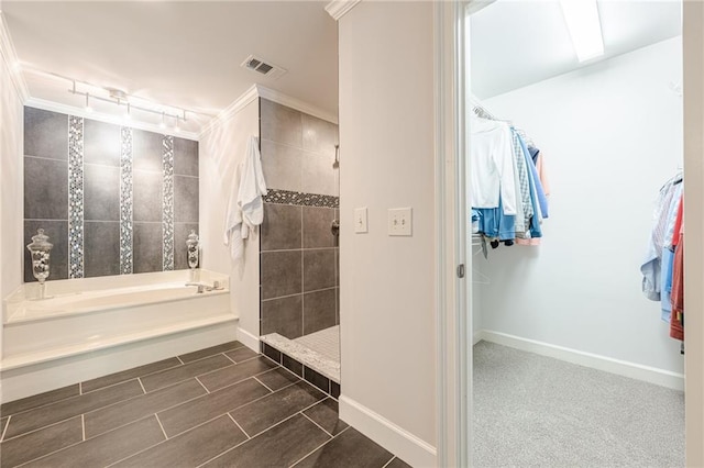 535 Brickleberry Ln, Roswell, GA 30075 - bathroom featuring a bath, a spacious closet, tiled shower, and crown molding
