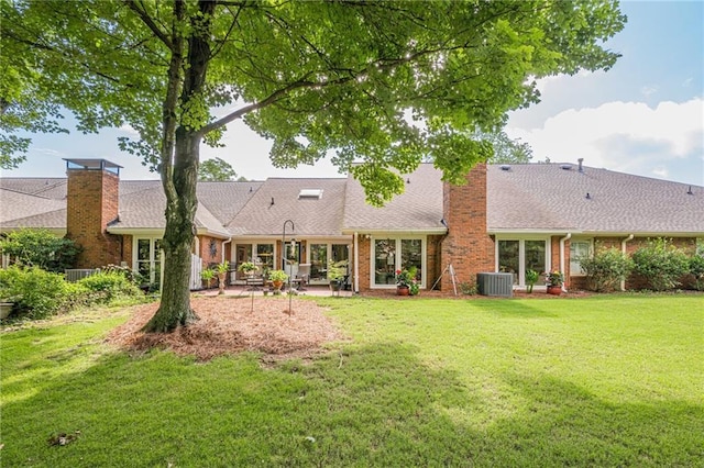 535 Brickleberry Ln, Roswell, GA 30075 - back of house with a chimney, a lawn, a patio, and brick siding