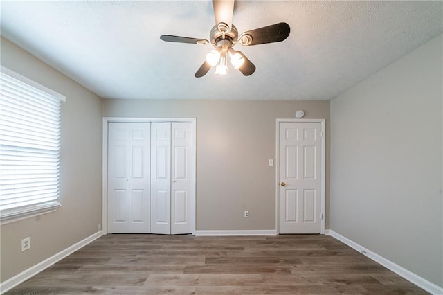 interior space featuring light wood-style floors, baseboards, and ornamental molding