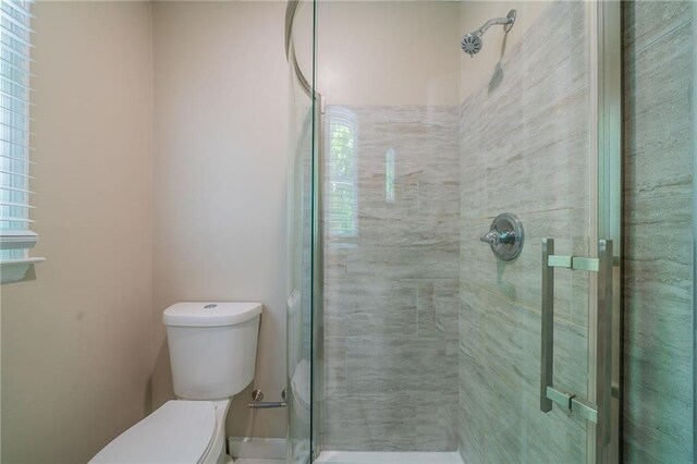 bathroom featuring vanity, toilet, marble finish floor, baseboards, and visible vents