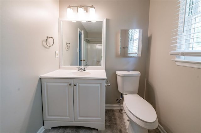 full bath with toilet and a shower stall