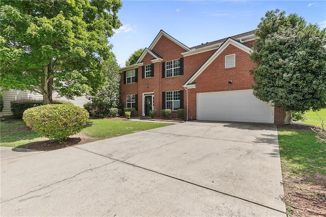 750 Ambrose Ln, Atlanta, GA 30349 - view of front facade featuring brick siding, driveway, a garage, and a front lawn