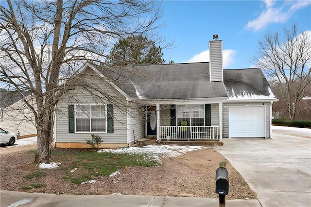 view of front of house featuring a garage and a porch