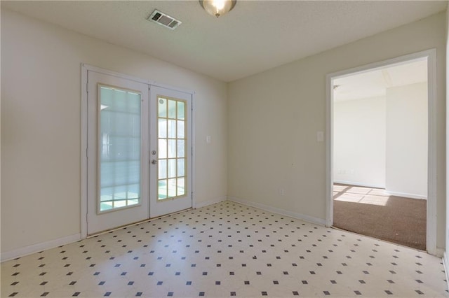 doorway to outside featuring french doors, visible vents, and baseboards