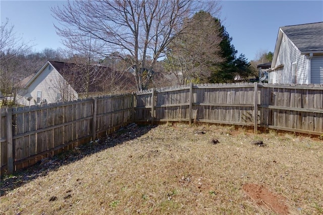 view of yard with a fenced backyard