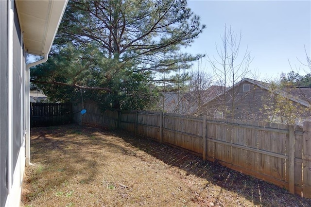 view of yard with a fenced backyard