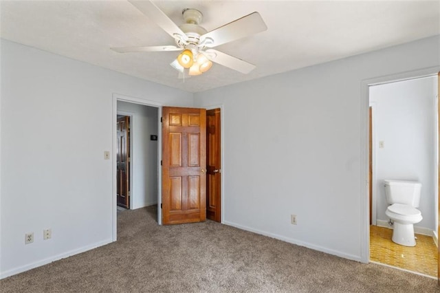 unfurnished bedroom featuring carpet, connected bathroom, and ceiling fan