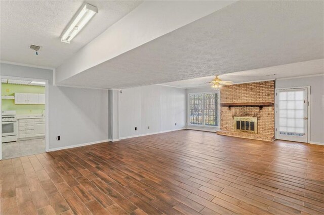 spare room featuring dark colored carpet and crown molding