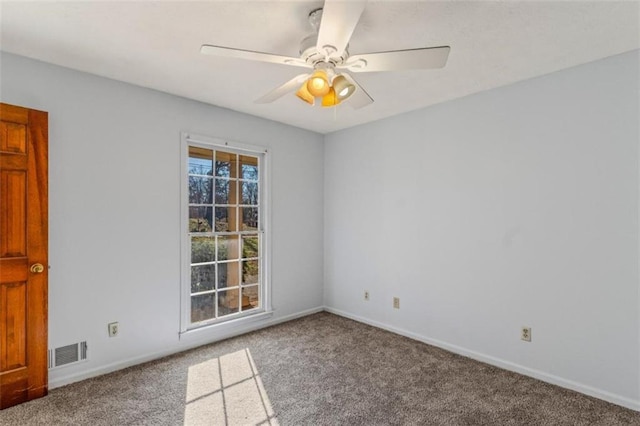 empty room with carpet floors and ceiling fan