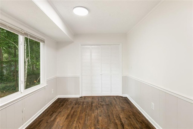 spare room featuring dark hardwood / wood-style flooring