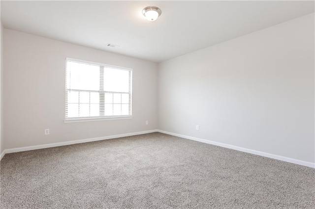 unfurnished room featuring carpet flooring