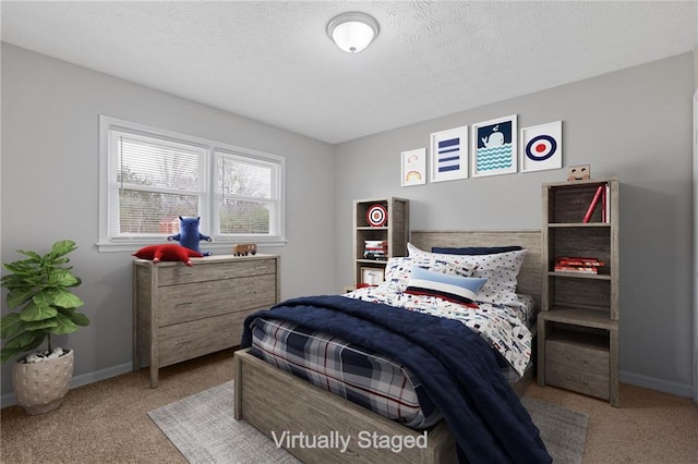 carpeted bedroom with a textured ceiling