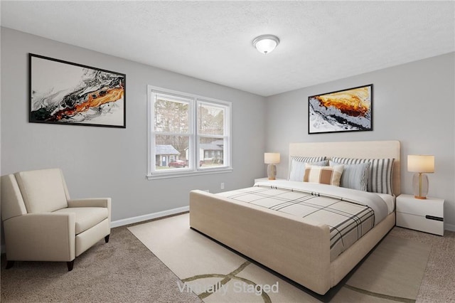 carpeted bedroom with a textured ceiling