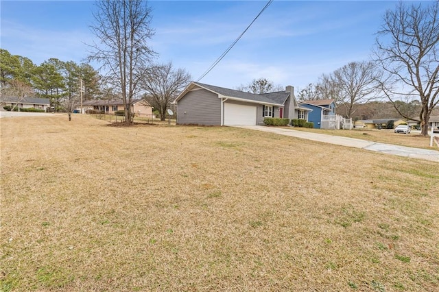 view of front of home with a garage and a front yard