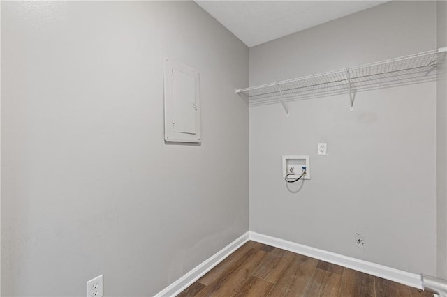 laundry room with dark wood-type flooring, hookup for an electric dryer, electric panel, and hookup for a washing machine