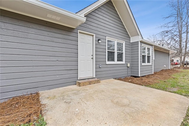 doorway to property with a patio