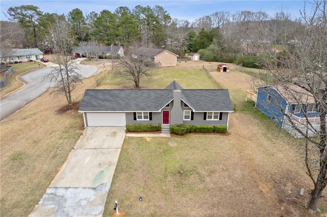 view of front of property with a garage and a front yard