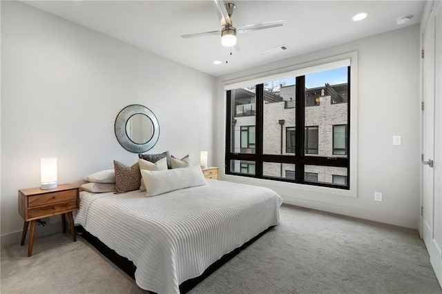 bedroom with recessed lighting, light colored carpet, visible vents, ceiling fan, and baseboards