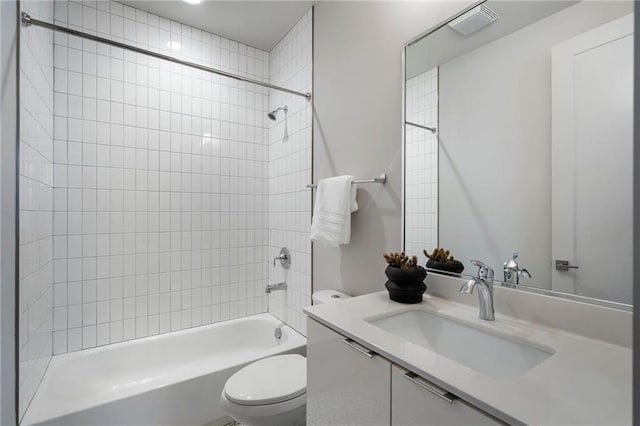 bathroom with visible vents, vanity, toilet, and shower / bathtub combination