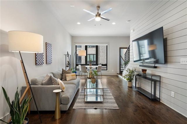 living room featuring baseboards, a ceiling fan, stairway, wood finished floors, and recessed lighting